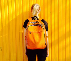 Girl standing with school backpack