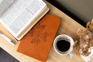 Open Bible With Journal and Coffee