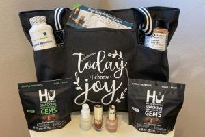 Women's wellness bag filled with supplements, gift certificate, and chocolates